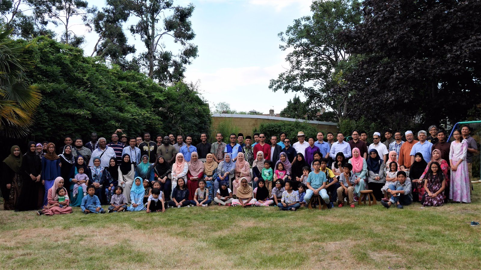 MAUK community members gathered outdoors for a group photo